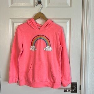 Snuggly neon red rainbow sweatshirt.